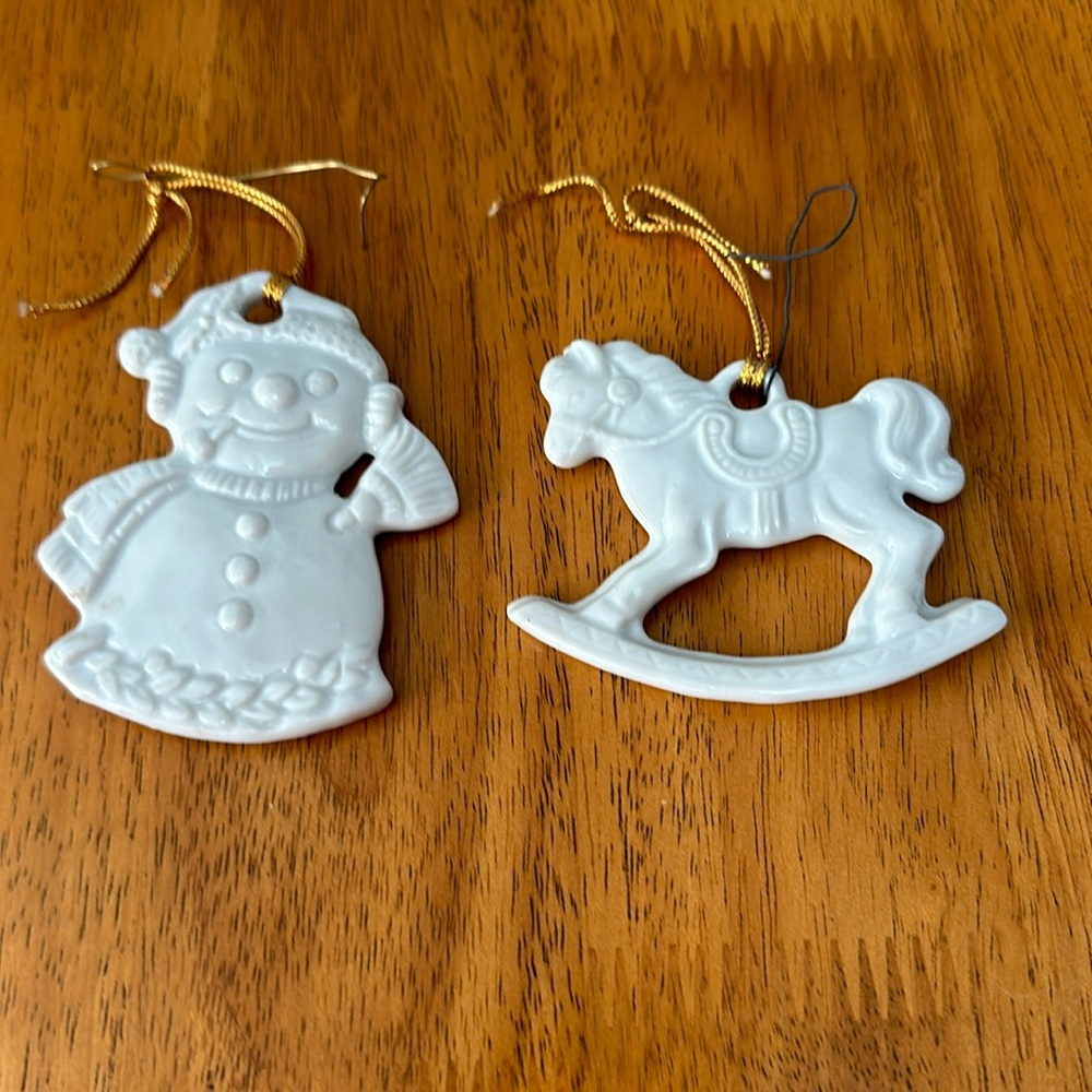 Pier 1 imports ornaments. White high gloss porcelain. Rocking horse. Snowman.